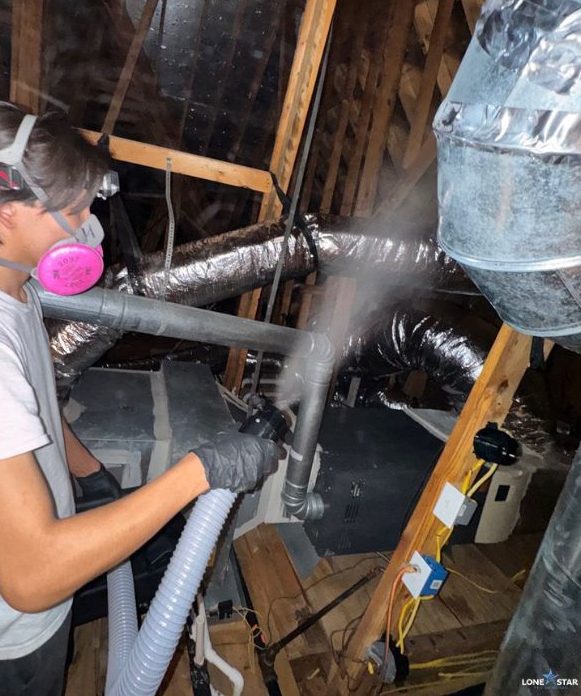 HVAC mold remediation technician cleaning air ducts in Houston